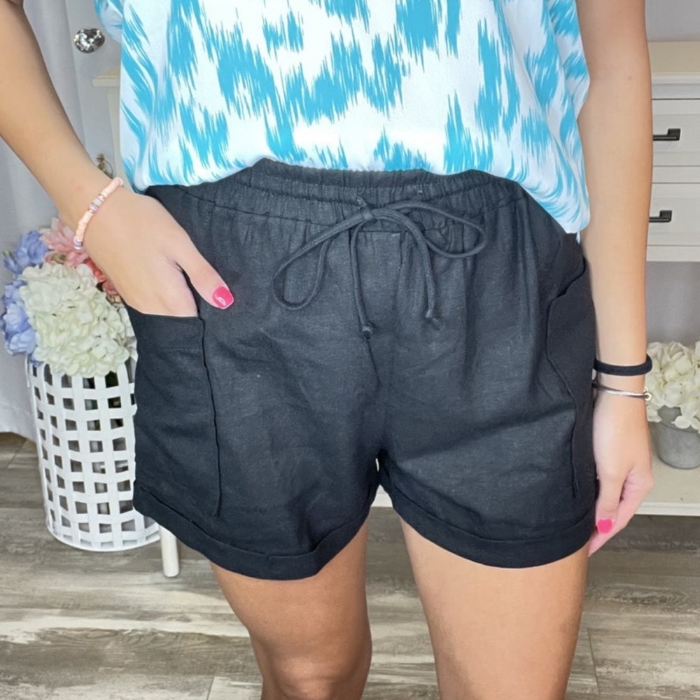 Black womens woven shorts. Side pocket and draw string. New